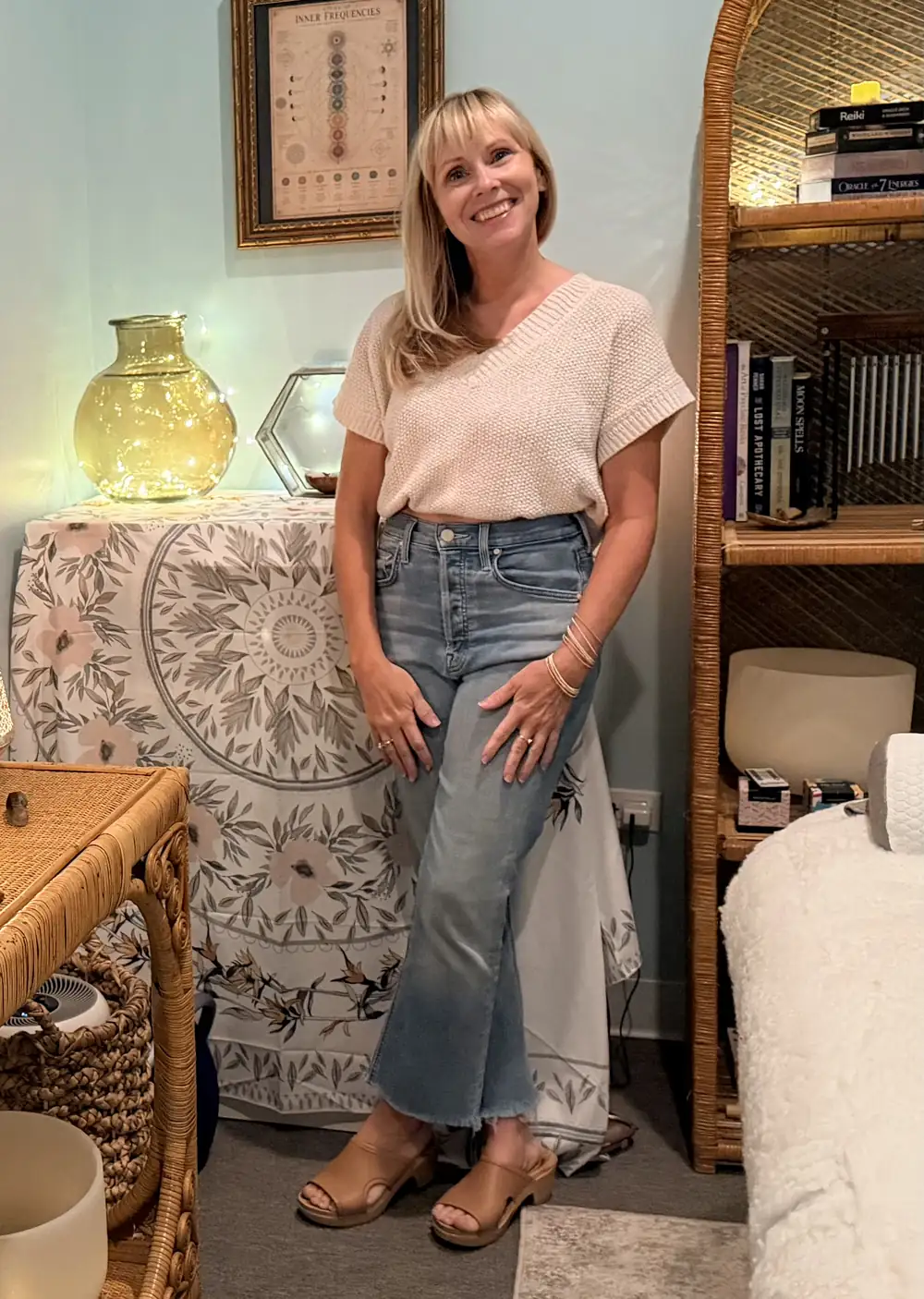 Tina beside the altar in her Oak Park Reiki studio